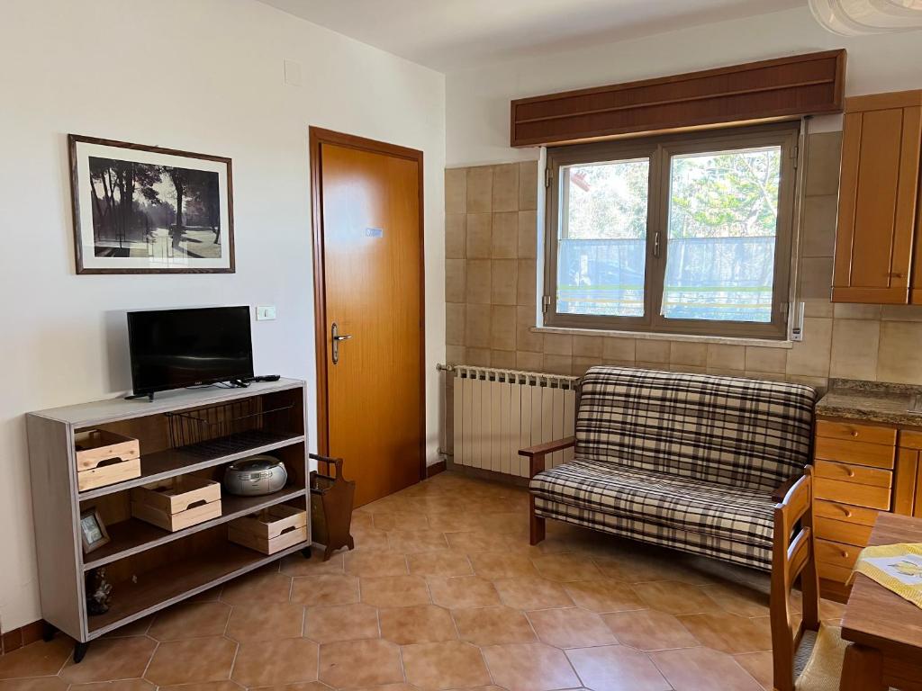 TV a/nebo společenská místnost v ubytování Casa vacanze La Via del Mare