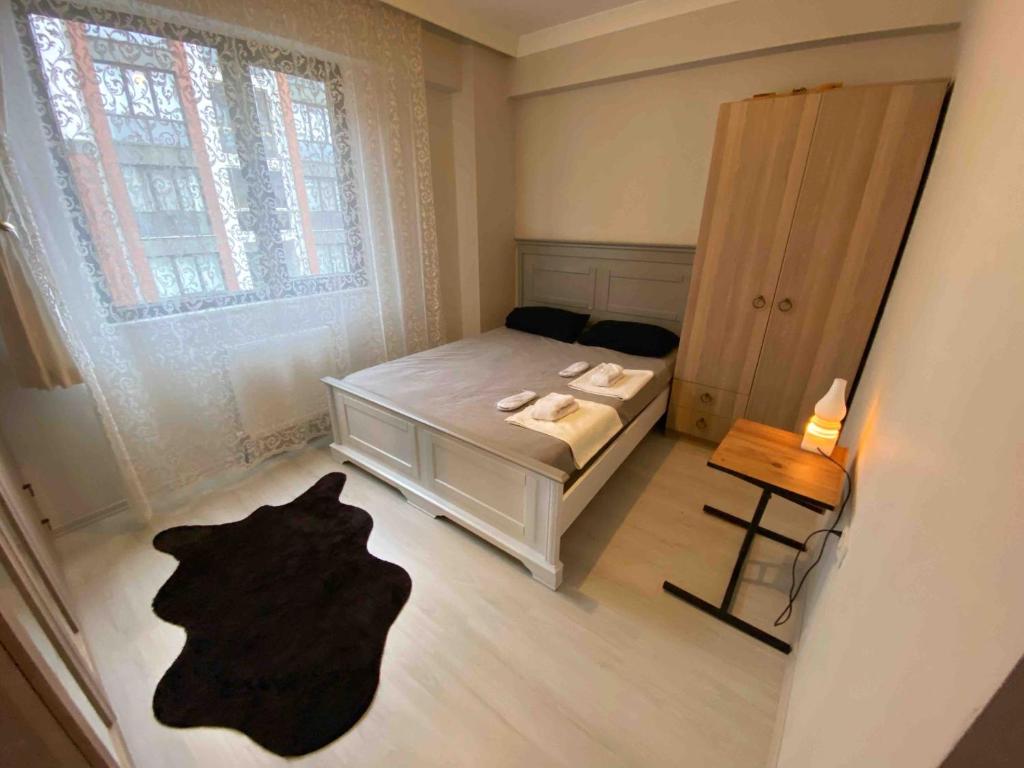 a small bedroom with a bed and a window at Private Room in Istanbul #36 in Istanbul