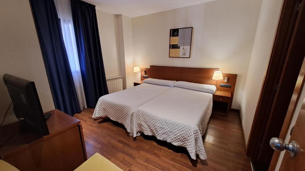 Postel nebo postele na pokoji v ubytování Hotel Suite Camarena