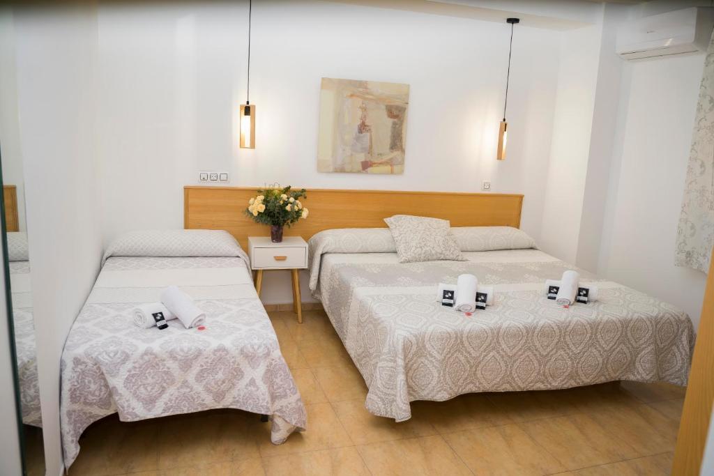Cama o camas de una habitación en Hostal Goyesco Plaza