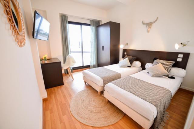 Postel nebo postele na pokoji v ubytování Single Fin Hotel & Lodge