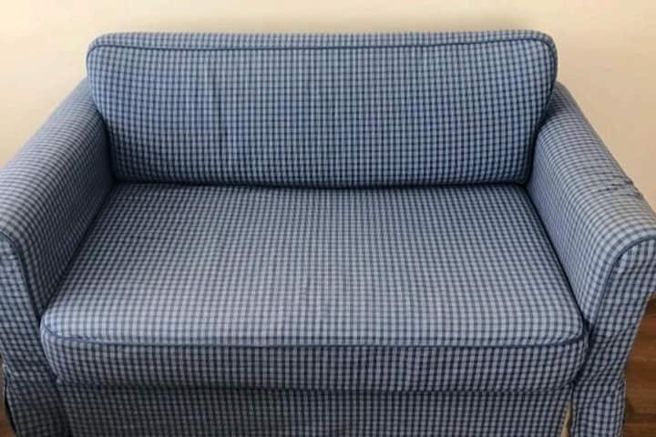 a blue checked chair sitting in a room at Private Room in Istanbul #44 in Tuzla