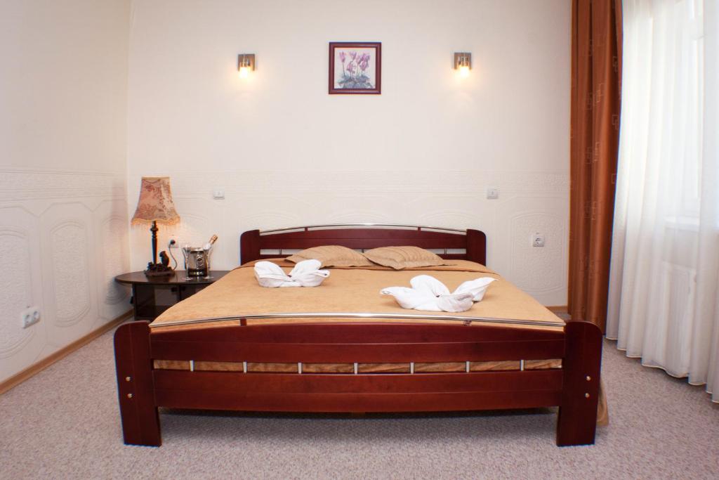 Postel nebo postele na pokoji v ubytování Dinaburg SPA Hotel