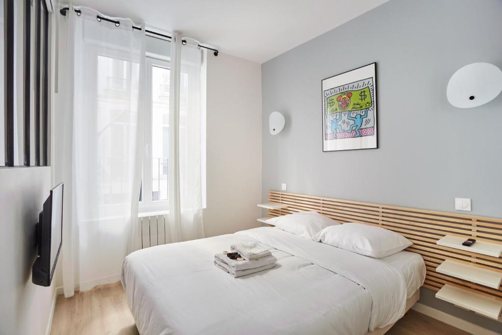 Posteľ alebo postele v izbe v ubytovaní Residence Center of Paris by Studio prestige