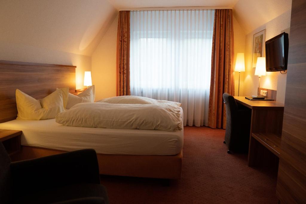 Postel nebo postele na pokoji v ubytování Hotel Jägerhof