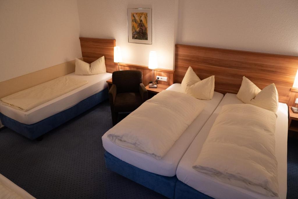 Postel nebo postele na pokoji v ubytování Hotel Jägerhof