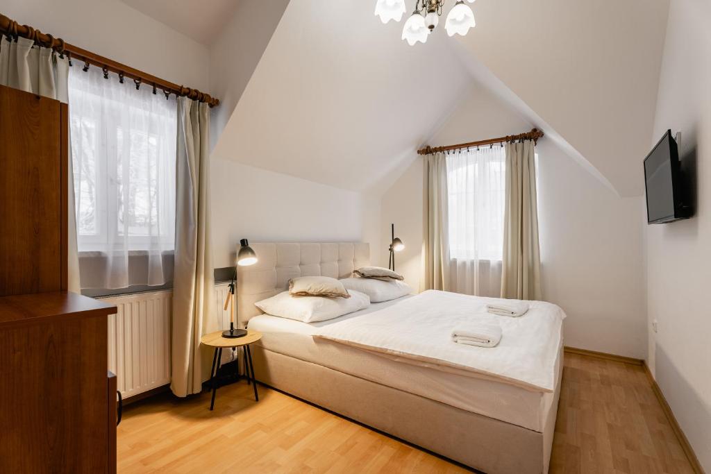 Postel nebo postele na pokoji v ubytování Vila Vyšehrad
