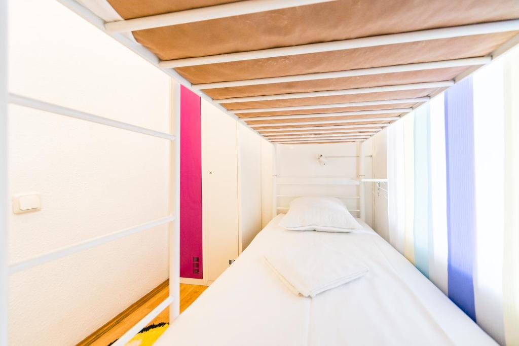 Postel nebo postele na pokoji v ubytování Muzey Hostel