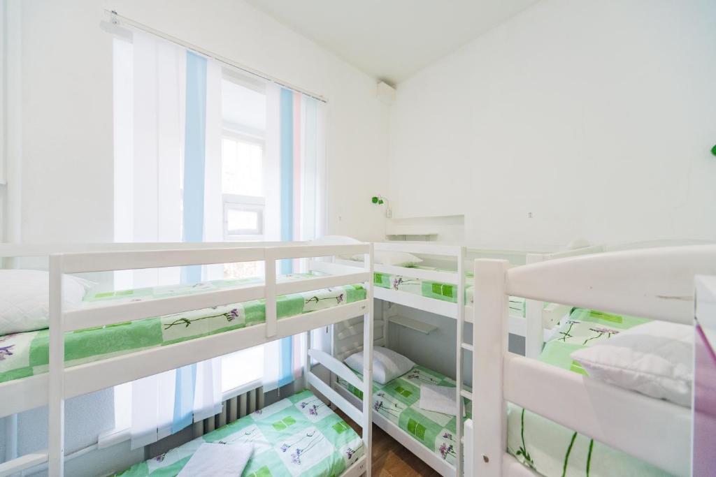 Postel nebo postele na pokoji v ubytování Muzey Hostel