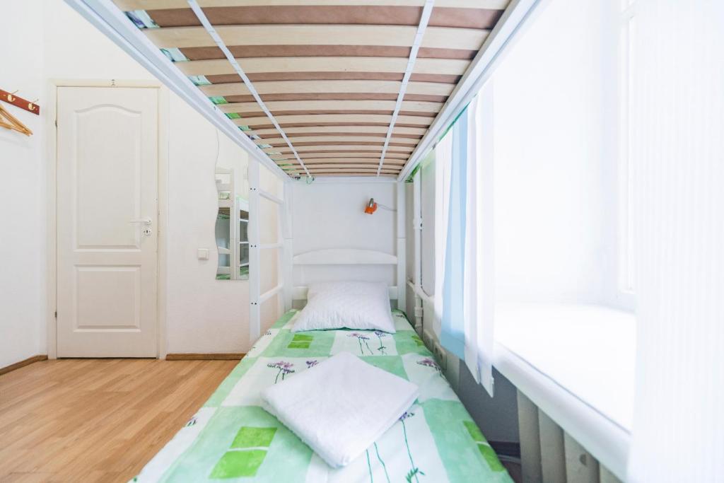 Postel nebo postele na pokoji v ubytování Muzey Hostel