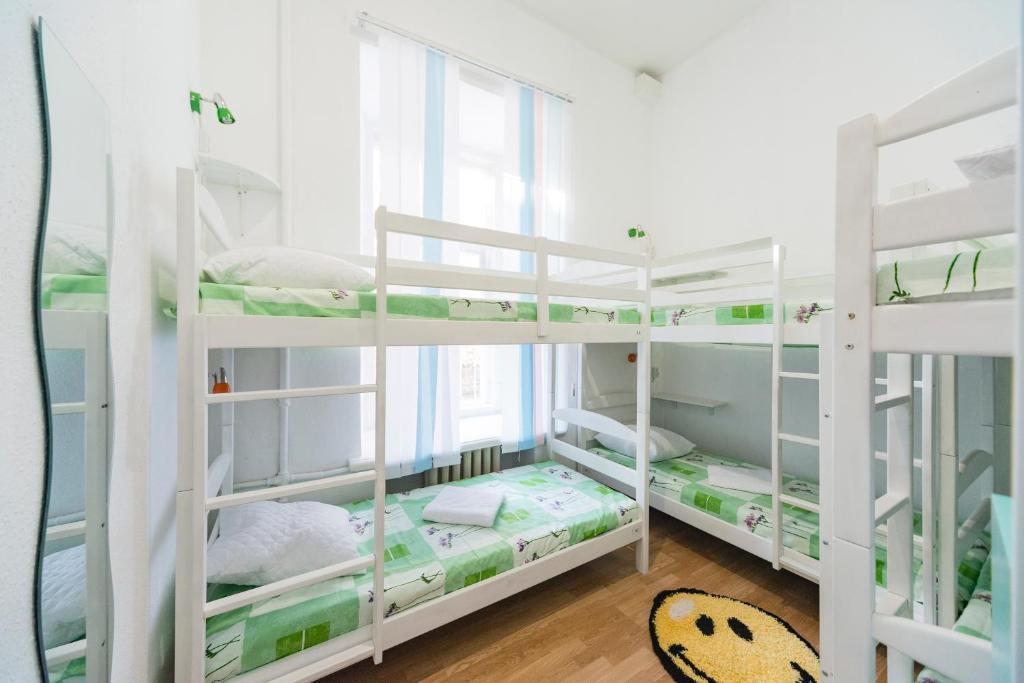 Postel nebo postele na pokoji v ubytování Muzey Hostel