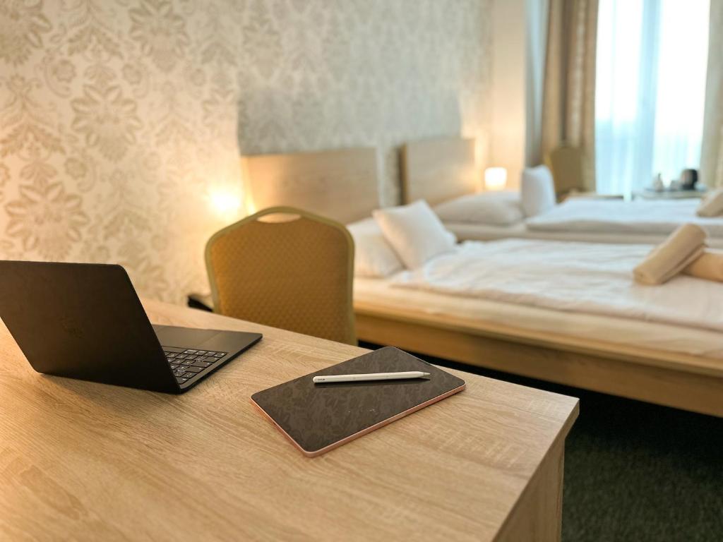 Postel nebo postele na pokoji v ubytování Hotel Modena