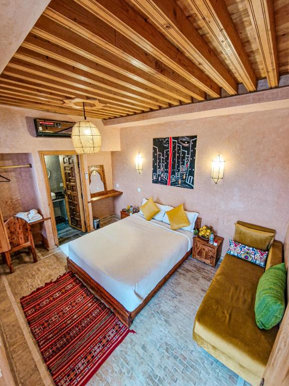 Postel nebo postele na pokoji v ubytování Riad El Pacha