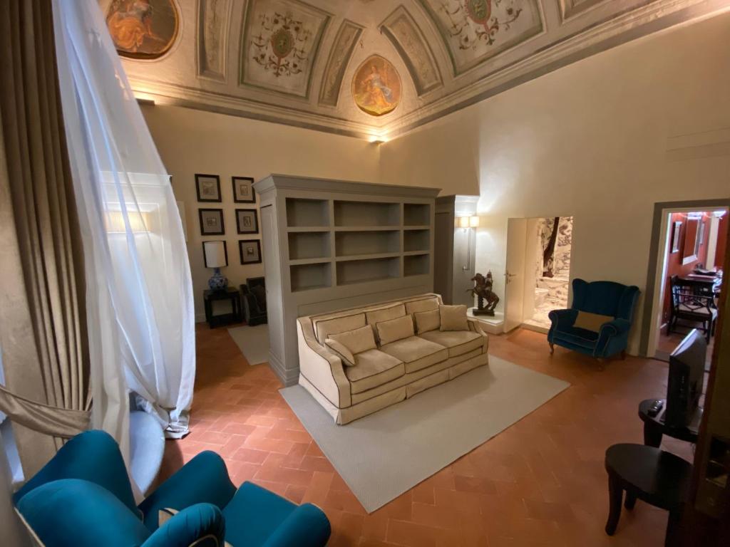 an overhead view of a living room with a couch at Luxury frescoed apartment in the center in Florence