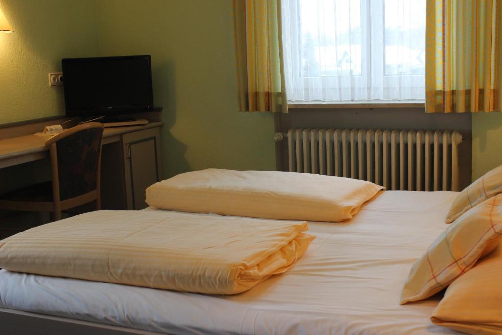Postel nebo postele na pokoji v ubytování Hotel Gasthof Seehof