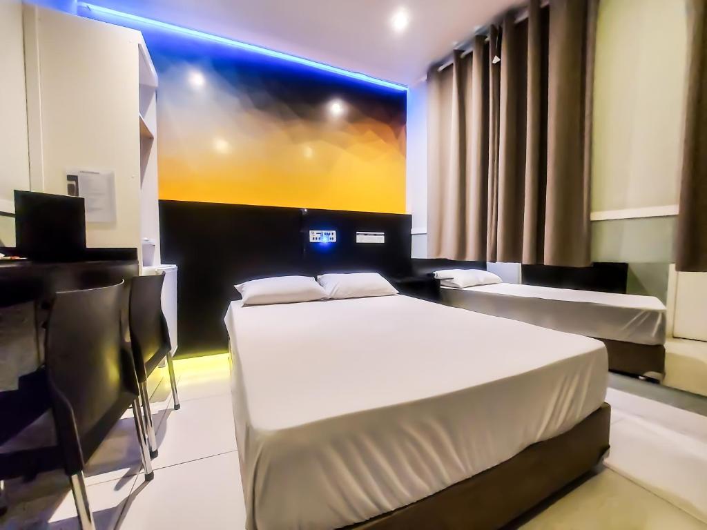 Postel nebo postele na pokoji v ubytování Único Motel Faria Lima