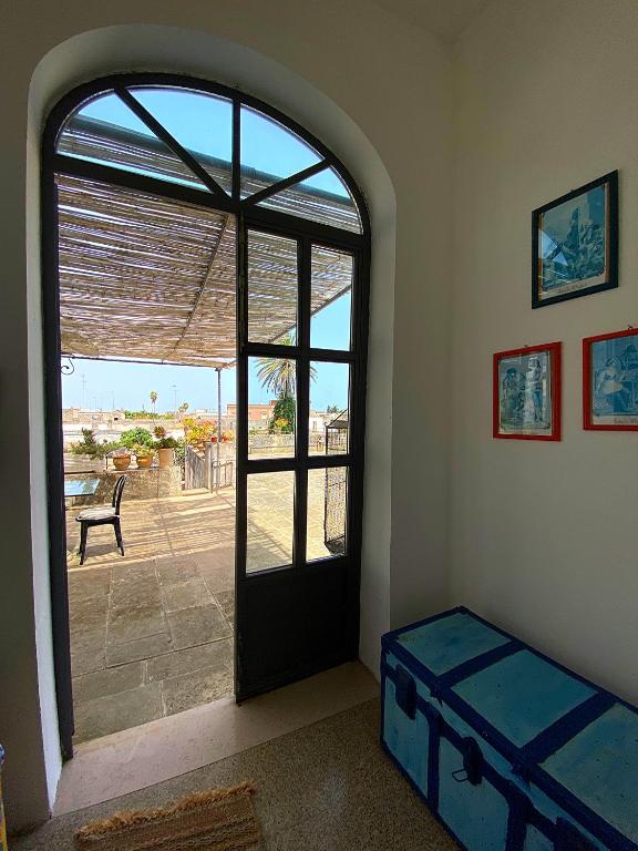 Postel nebo postele na pokoji v ubytování Palazzo Sabella Tommasi