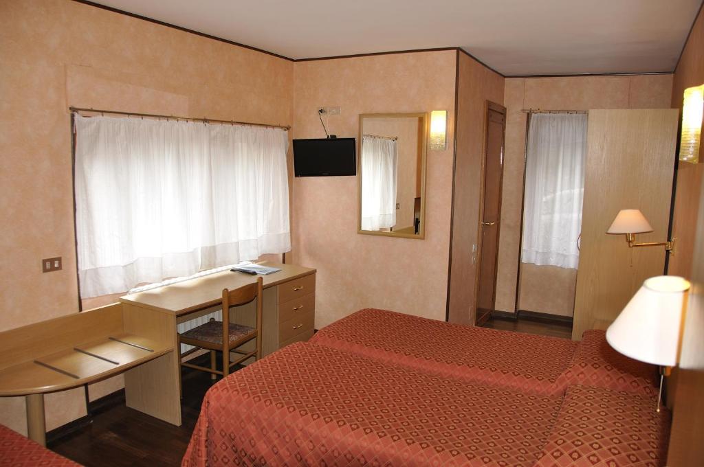 Postel nebo postele na pokoji v ubytování Hotel Sud Ovest