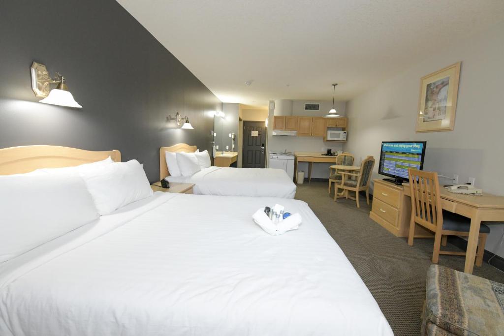 Postel nebo postele na pokoji v ubytování Prime Hotel