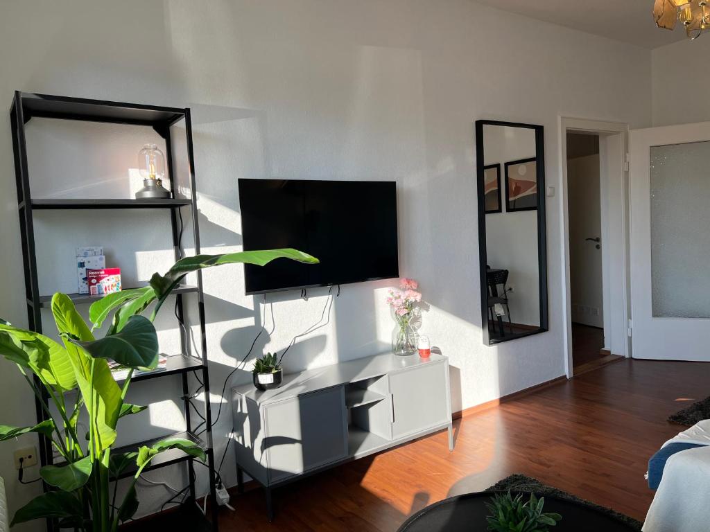 TV a/nebo společenská místnost v ubytování Zentrale Apartments im Herzen vom Bremerhaven