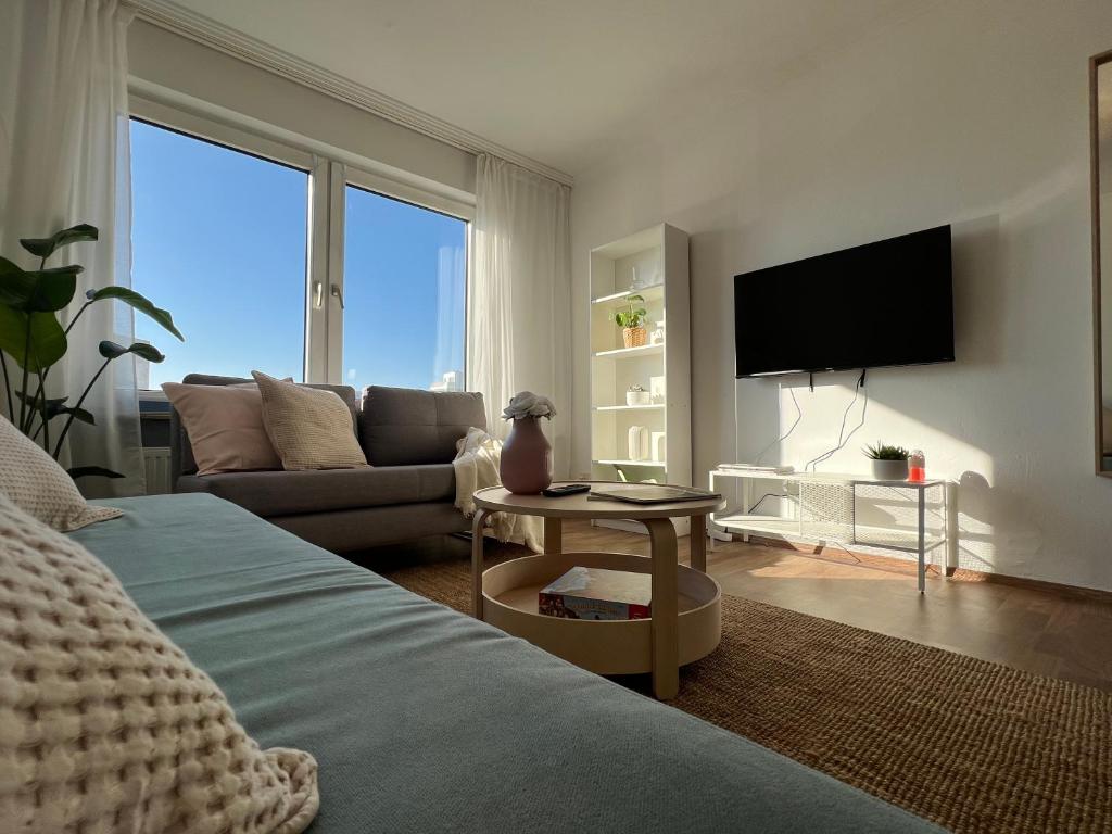 TV a/nebo společenská místnost v ubytování Zentrale Apartments im Herzen vom Bremerhaven