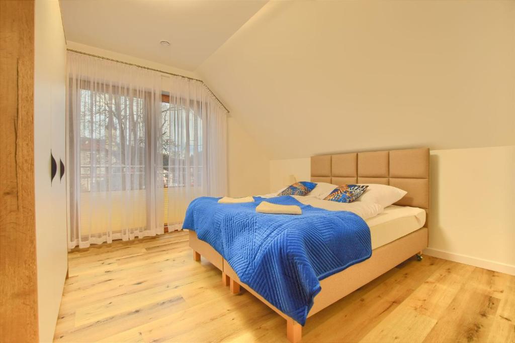 Postel nebo postele na pokoji v ubytování Apartamenty Bianka