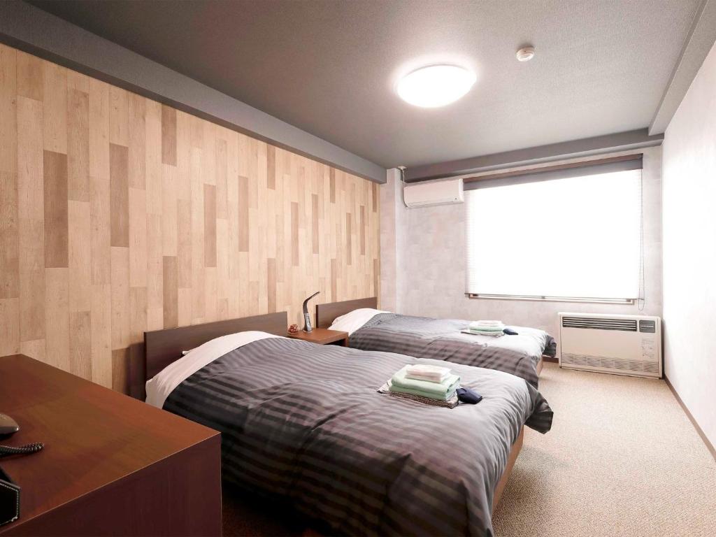Katil atau katil-katil dalam bilik di Apprising hotels GranJam Tsugaike - Vacation STAY 77378v