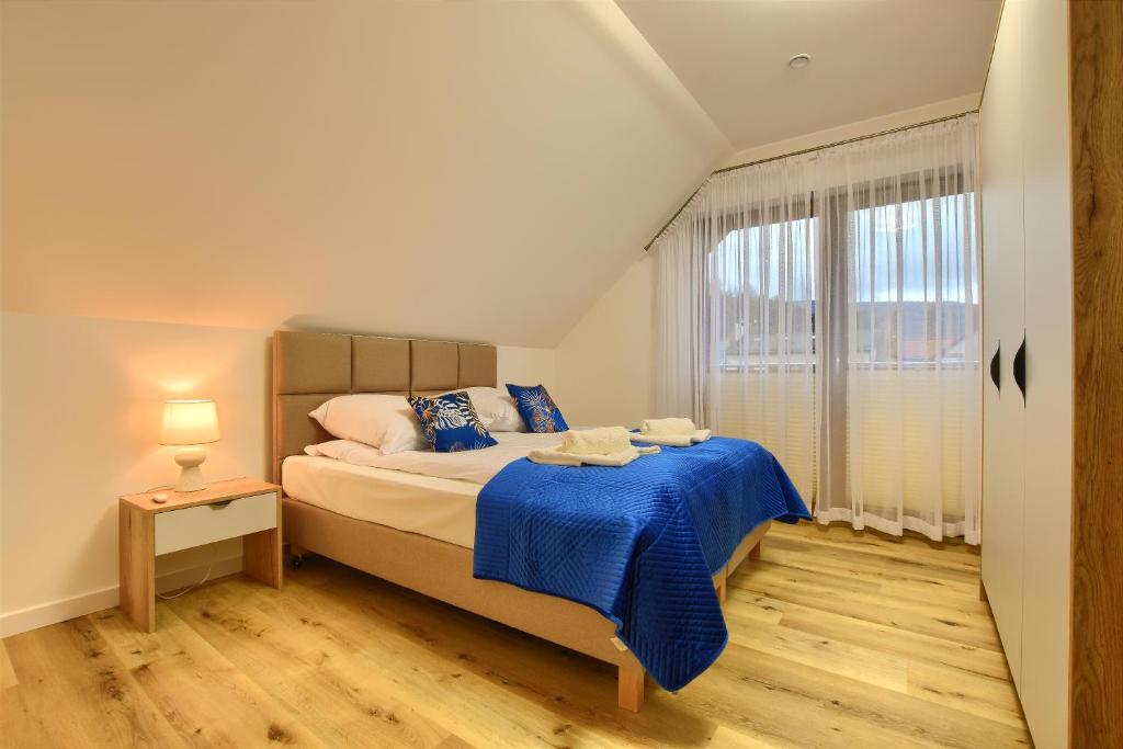 Postel nebo postele na pokoji v ubytování Apartamenty Bianka