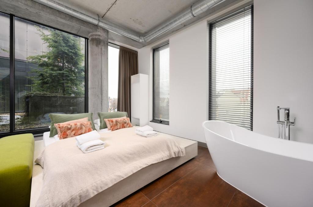 Posteľ alebo postele v izbe v ubytovaní Rich Sopot by OneApartments
