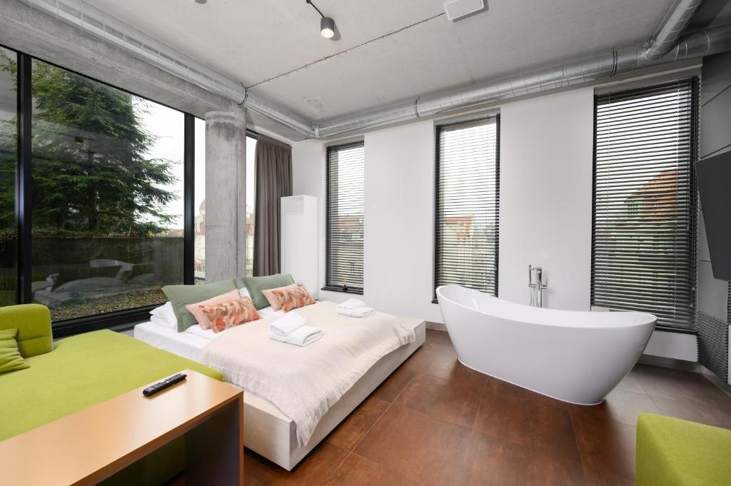 Posteľ alebo postele v izbe v ubytovaní Rich Sopot by OneApartments