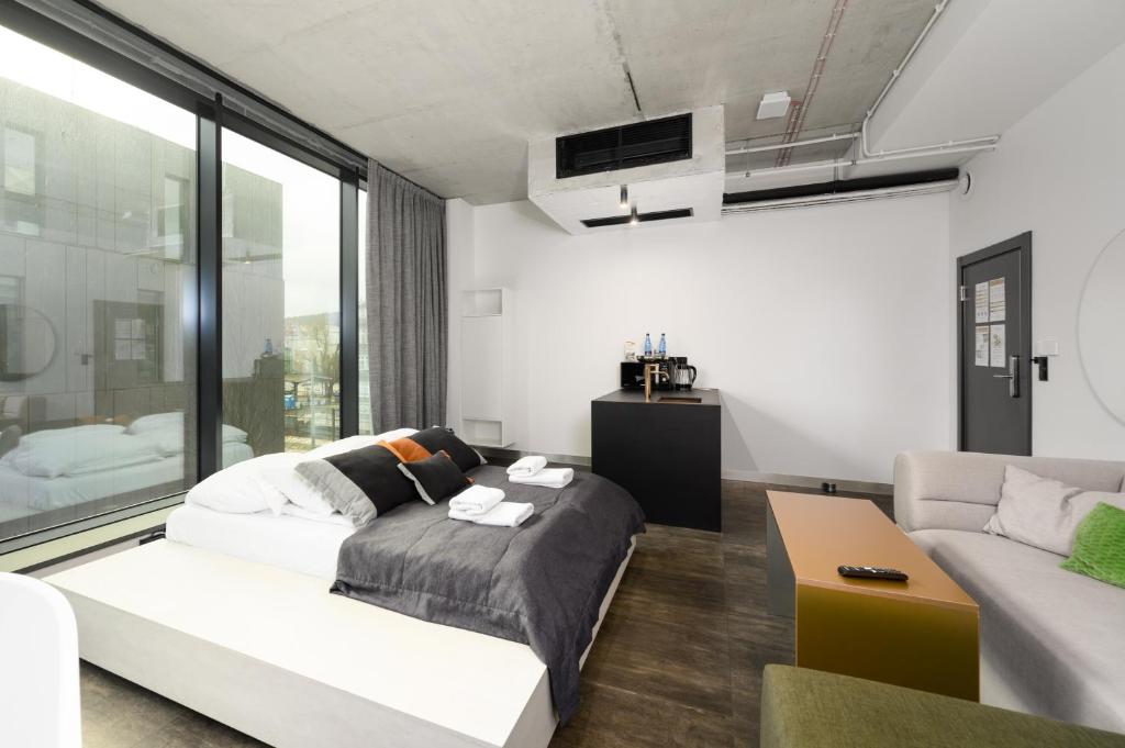 Posteľ alebo postele v izbe v ubytovaní Rich Sopot by OneApartments