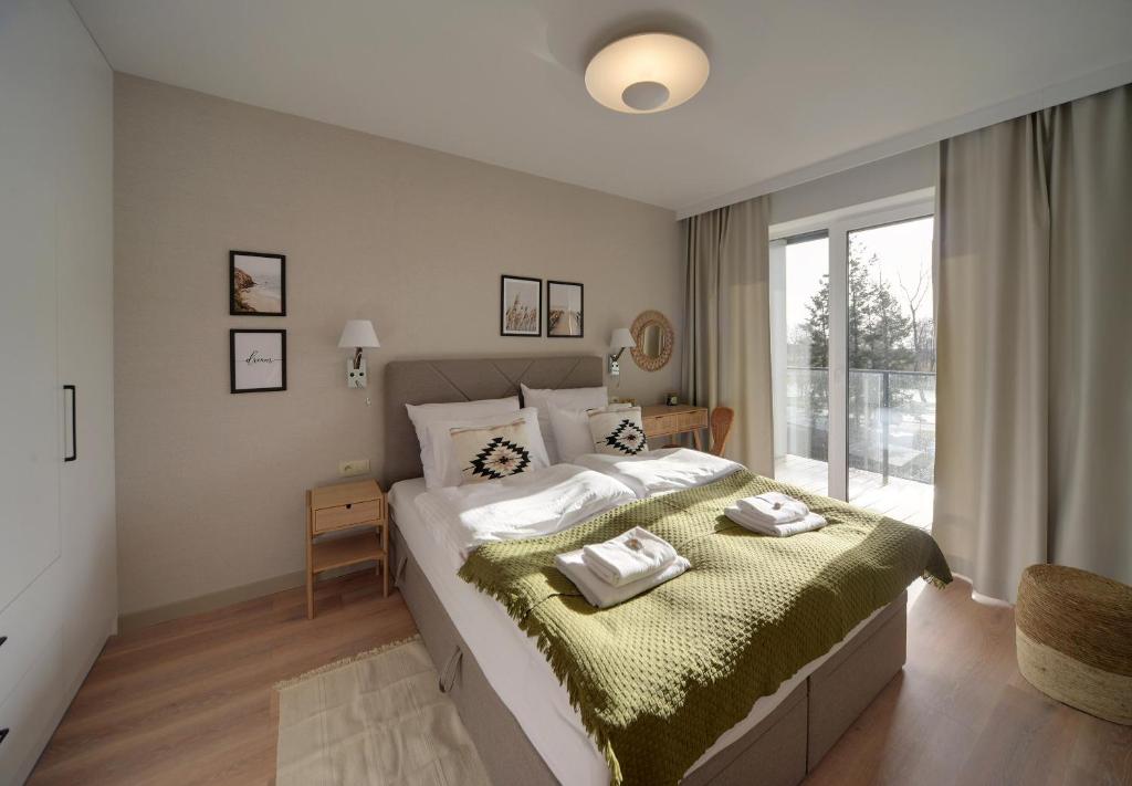 Posteľ alebo postele v izbe v ubytovaní Apartament Dziwnów Sagaris Spa