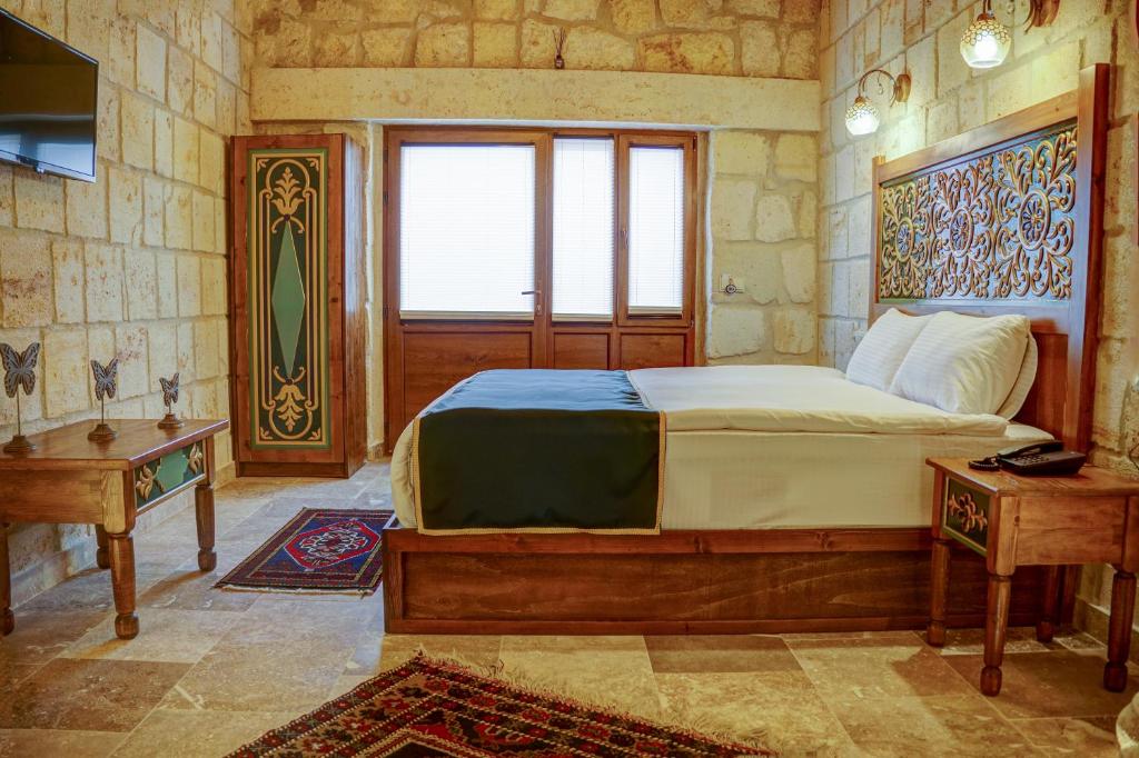 Postel nebo postele na pokoji v ubytování Cappadocia Sweet Cave