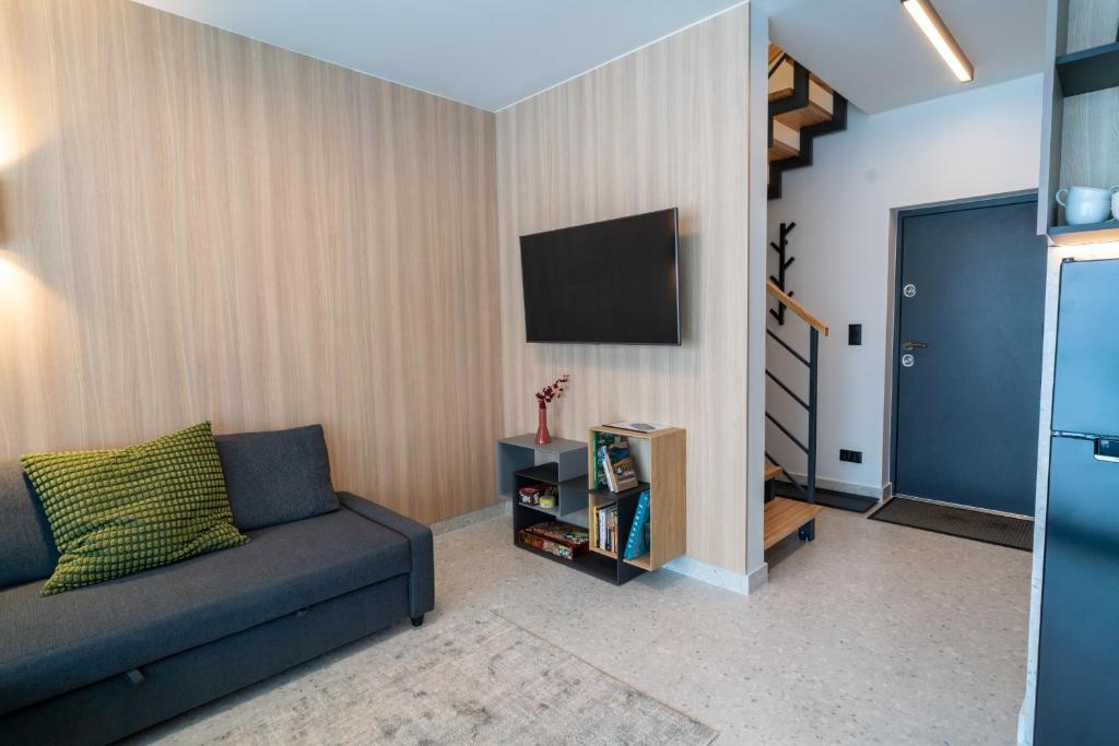 Televízia a/alebo spoločenská miestnosť v ubytovaní Campo Resort