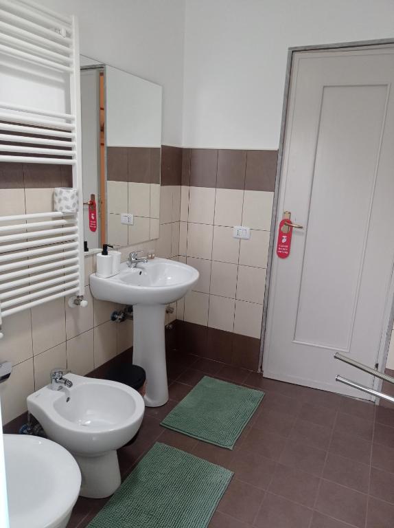 a bathroom with a sink and a toilet at CasaRA in Bari