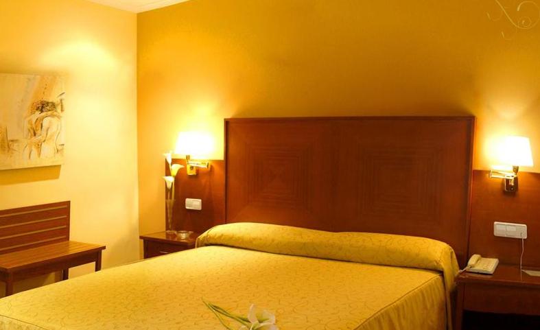 A bed or beds in a room at Casa Quiquet