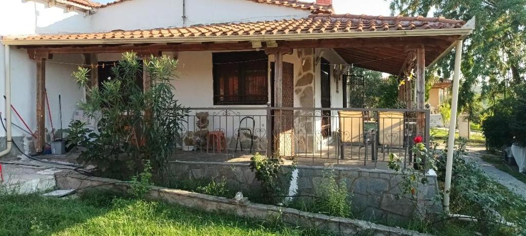 a house with a pergola in the yard at Alex house with garden in kallithea halkidiki in Kallithea Halkidikis