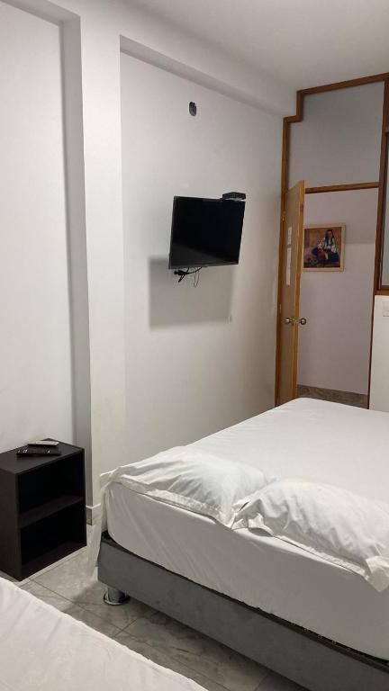 Postel nebo postele na pokoji v ubytování CASA SHILCAYO Habitaciones Vacacionales