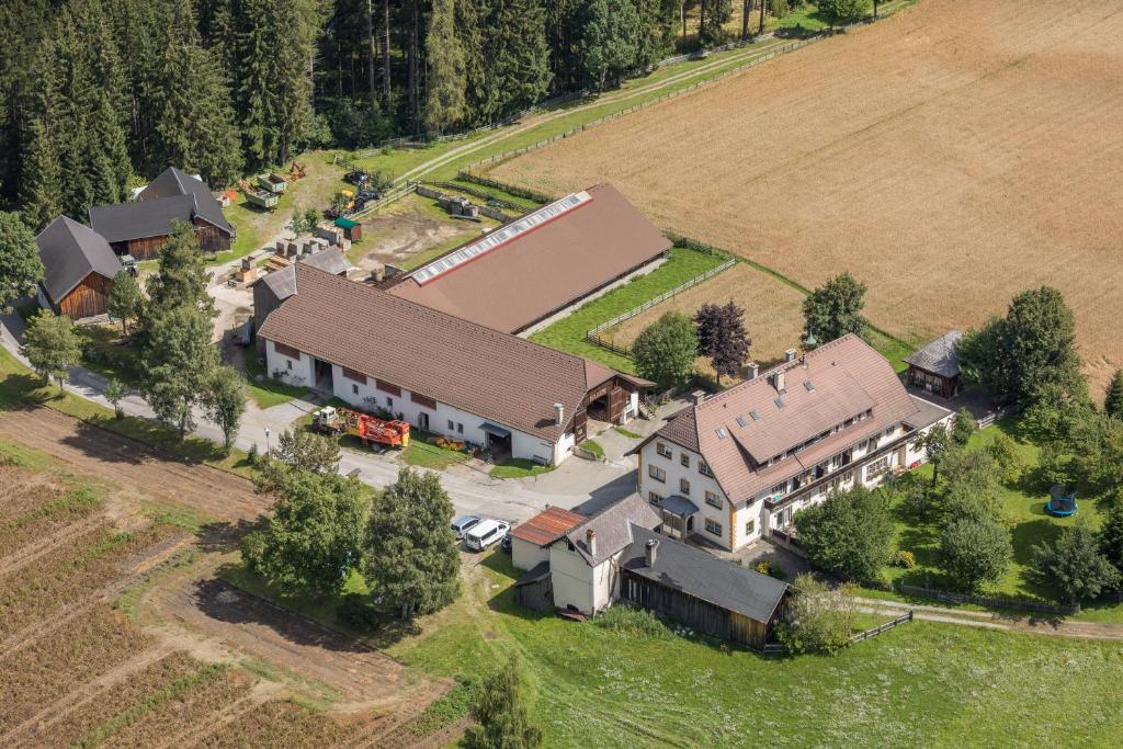 an aerial view of a large house with a barn at Waldgasthof Passegger in Sankt Andrä im Lungau