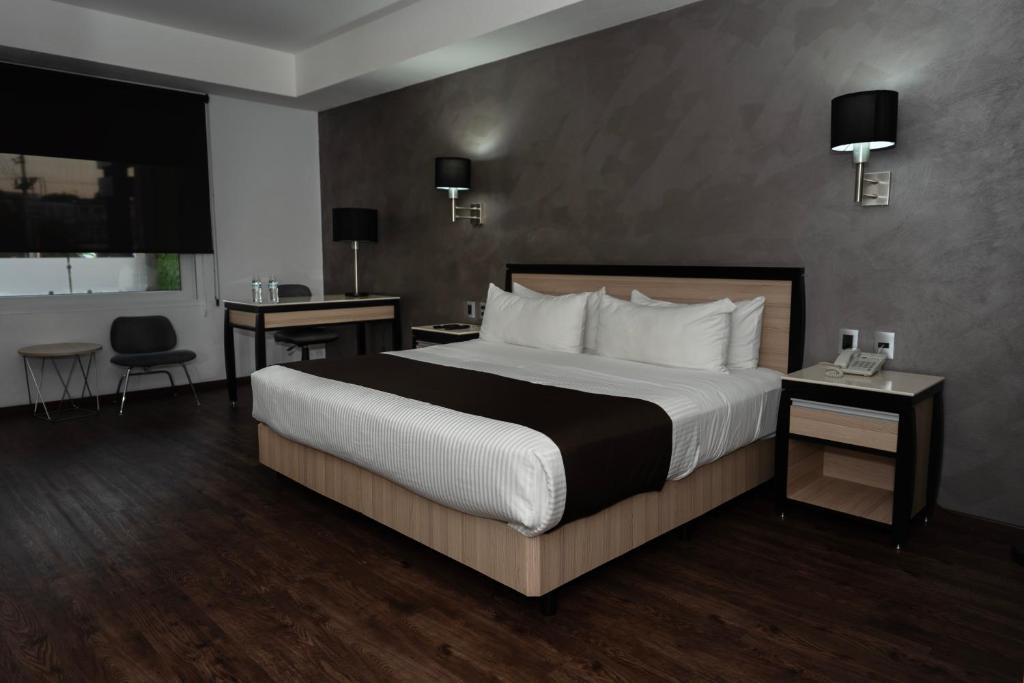Postel nebo postele na pokoji v ubytování Fato Hotel