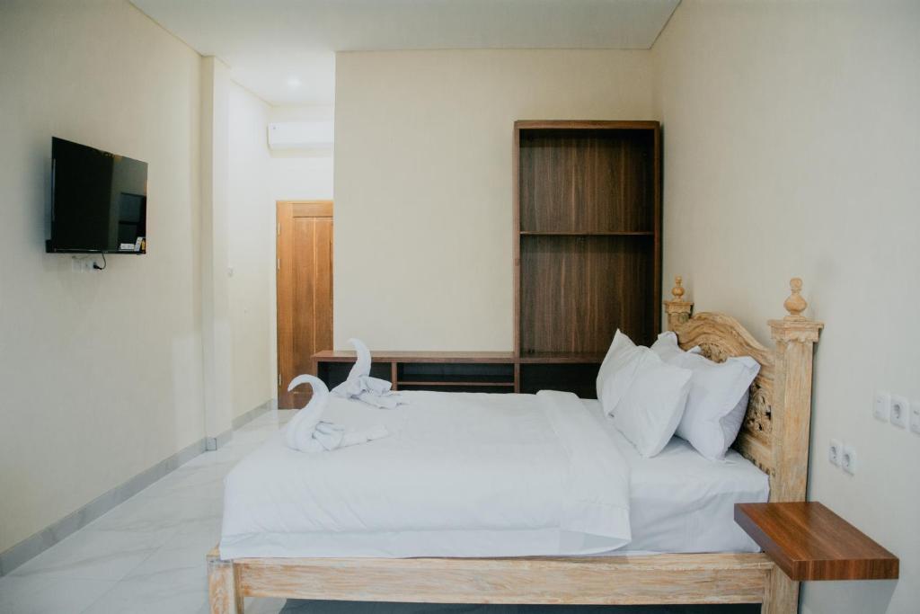 Postel nebo postele na pokoji v ubytování THE LAVIANA HOTEL