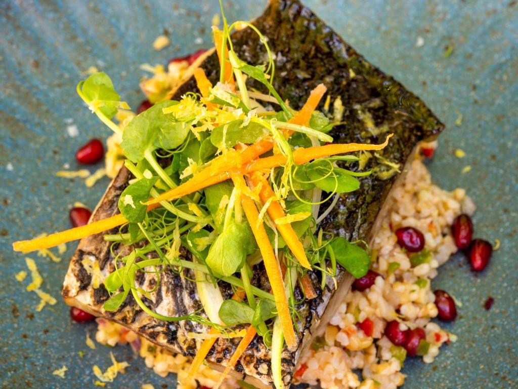 a plate of food with greens and vegetables on it at Mercure Benidorm in Benidorm