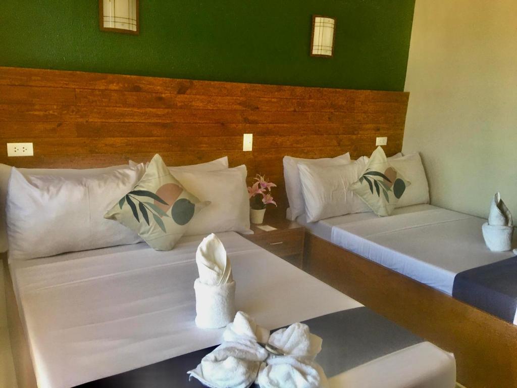 Cama o camas de una habitación en A&A ABE BAYFRONT INN