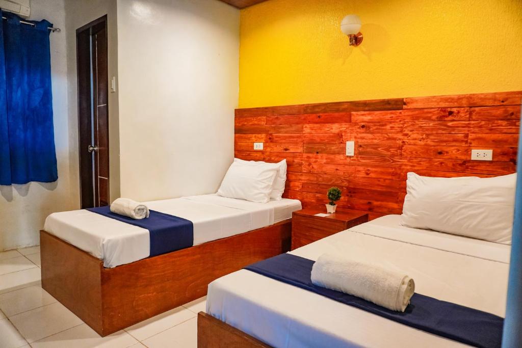 Cama o camas de una habitación en A&A ABE BAYFRONT INN
