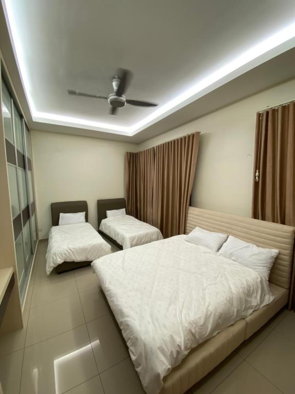 a bedroom with two beds and a ceiling at 15PAX 3 BR, Kids Swimming Pool, Pool table, BBQ near Spice ARENA, Airport Penang in Bayan Lepas
