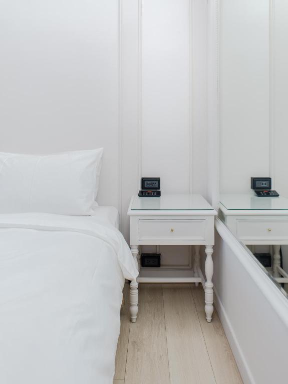 Postel nebo postele na pokoji v ubytování Archess Hotel