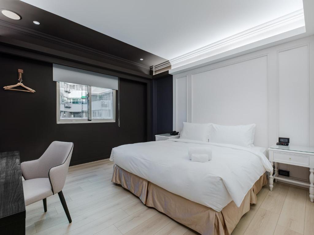 Postel nebo postele na pokoji v ubytování Archess Hotel