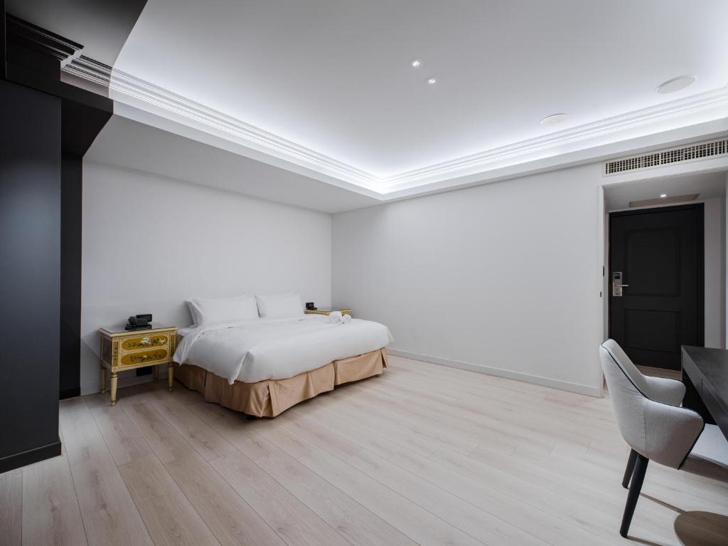 Postel nebo postele na pokoji v ubytování Archess Hotel