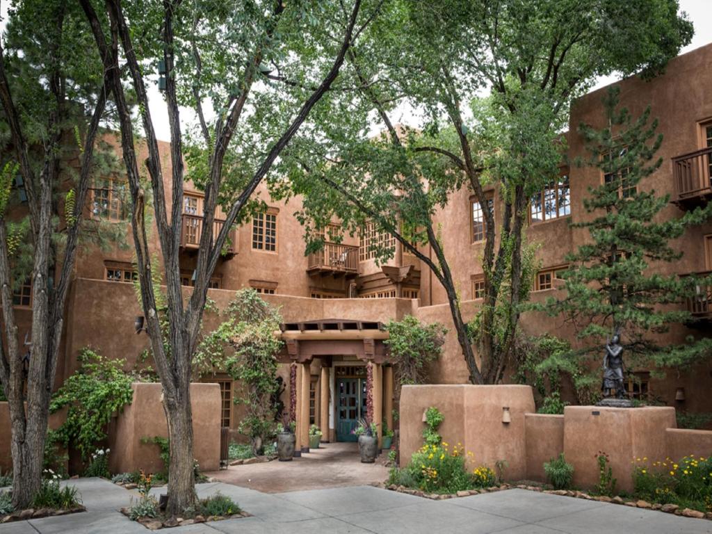 an exterior view of a building with trees at Hotel Santa Fe in Santa Fe