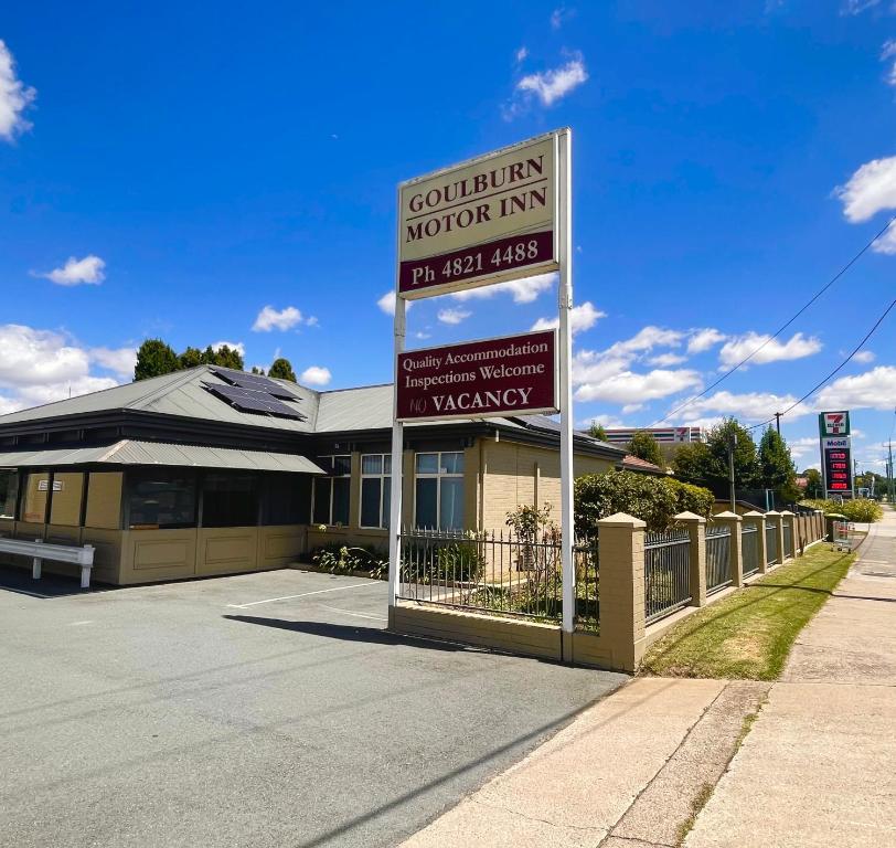 a building with a large sign in front of it at Goulburn Motor Inn in Goulburn